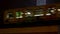 Television Tower with snow at night and trains leaving and arriving, Alexanderplatz Station, Berlin, Germany