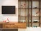 Television on wall an wooden timber shelf units