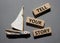 Tell your story symbol. Wooden blocks with words Tell your story. Beautiful grey background with boat. Business and Tell your