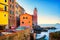 Tellaro sea village street, church and boats. Cinque terre, Ligury Italy