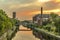 The Teltow Canal in Berlin-Tempelhof, Germany, overlooking bridges and old factory buildings in the light of the sun