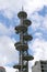 Telus telecommunications tower equipment and repeater antenna dishes against blue sky