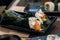 Temaki sushi roll with fresh salmon, avocado and philadelphia cheese