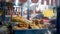 Tempe Mendoan and various fried foods in the storefront of street food carts.