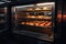 temperature-controlled holding cabinet with plates of freshly baked pastries