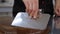 Tempering of the chocolate on the metal surface in the pastry shop.