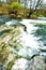 Tempestuous river with small stone rapids