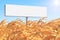 Template as white empty rectangular form billboard on a yellow corn field and on the background of blue sky and sun