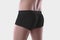 Template black cotton masculine boxers on a man, close-up, brief trunks isolated on the background in the studio