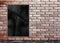 Template- Black Crumple Poster on grunge brick wall & footpath g