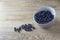 Template blueberries in a grey bowl on a wooden table
