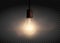 Template Edison retro light bulb is glowing in the dark. Isolate
