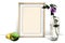 Template picture in frame standing on the table next to a glass vase with a flower and with an Apple and lemon