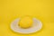 Template with yellow background. Isolated lemon fruit on white plate. Flatly, top view. Minimal flatly. Healthy food.  Single