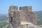 The temple of Athena and Assos castle, where blue and green goose mountains. Canakkale, Turkey