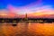 A temple landmark of Bangkok `Wat Arun ` under colorful sunset reflect on chaopraya river