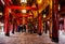 Temple of literature in Hanoi. Interior view with typical red wooden construction and chinese symbols. Hanoi, Vietnam - 04/02/