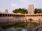 The temple tank surrounded by the tower spires of the ancient Hindu temple complex of