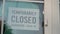 TEMPORARILY CLOSED sign on a frontdoor, Close Up