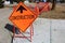 Temporary construction ahead sign on a sidewalk