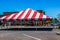 Temporary Red & White Striped Canopy In Parking Lot