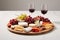 Tempting Cheese Selection with Fresh Grapes, Assorted Nuts, and Classy Red Wine Pairing