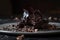 Tempting close-up image of dark chocolate flakes on a delicate white platter