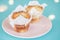 Tempting cupcakes on a pink dish on a colorful background