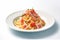 Tempting Ham Pasta: A Flavorful Dish on a Clean White Background