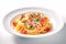 Tempting Pasta Perfection: Plate of Ham and Parsley-Garnished Pasta on a White Background