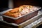 Tempting treat, homemade banana bread served on steel baking tray