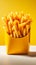 Tempting yellow box holds golden fries on a white backdrop