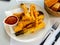 Tempura fried calcots served with Romesco sauce