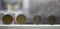 Ten baht and five baht coin stand on blur background