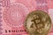 Ten Bangladeshi taka note with a golden bitcoin