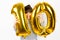 Ten birthday party girl with golden balloons