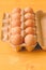 Ten chicken eggs in cardboard box