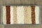 Ten different varieties of rice in metal rectangular dish