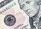 Ten dollar bill focus on federal reserve seal