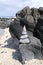 A ten stone cairn at the edge of an ocean