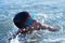 Ten year old boy teenager swims in the sea
