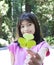 Ten year old girl holding three leaf clover