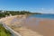 Tenby beach Wales uk in summer with tourists and visitors blue sea and sky