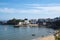 Tenby North  iconic beach sandy beach with the pinnacle of Goskar rock sticking out of the sand in the middle.