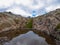 Tende - Panoramic view of small glacier pond in the Mercantour National Park in the Valley of Marvels near Tende