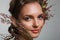 Tender beauty portrait of bride with roses wreath in hair