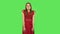 Tender confused girl in red dress is saying oops and shrugging. Green screen