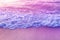 Tender dreamy pink sea waves on shore