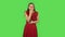 Tender girl in red dress is getting a cold, sore throat and head, cough. Green screen