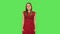 Tender girl in red dress is looking at camera with anticipation, then very upset. Green screen